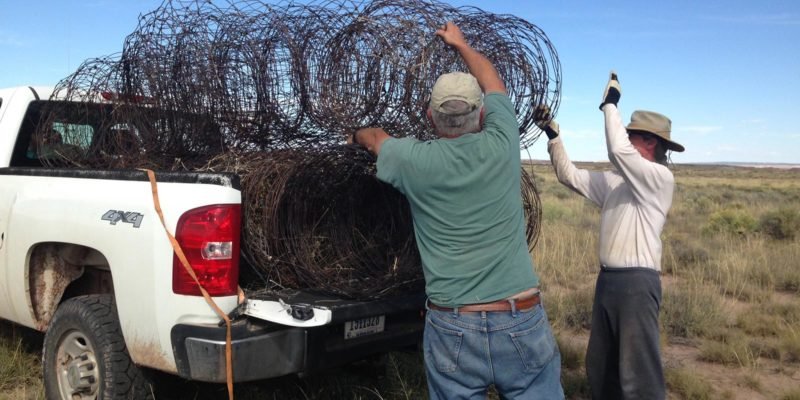 Volunteers help remove unneeded fence | NPS Photo