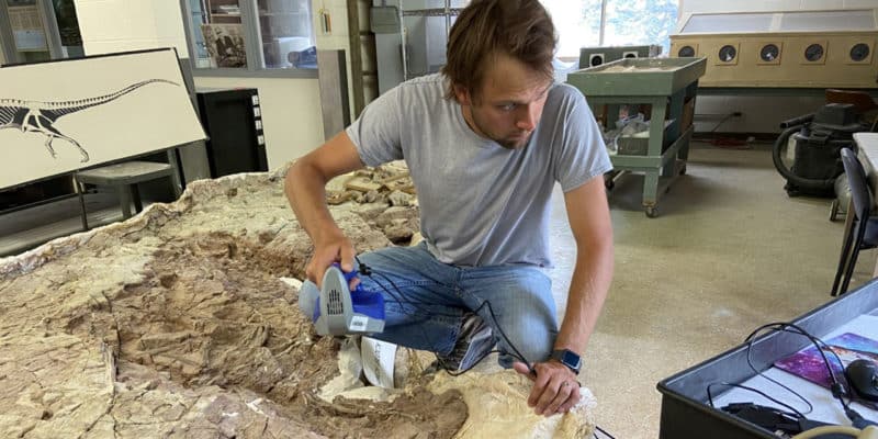 Adam Marsh, Ph.D., scanning fossil with 3D scanner