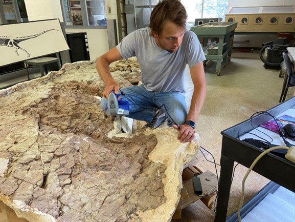 Dr. Adam Marsh uses the 3D laser scanner to digitize the anatomy of two Triassic crocodylomorphs in a large block at the Museum of Northern Arizona.